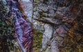Colorful rocks, water erosion, a small waterfall Royalty Free Stock Photo