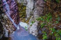 Colorful rocks, water erosion, a small waterfall Royalty Free Stock Photo