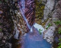 Colorful rocks, water erosion, a small waterfall Royalty Free Stock Photo