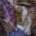 Colorful rocks, water erosion, a small waterfall Royalty Free Stock Photo