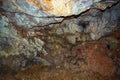 Colorful rocks of Zoodochos Pigi Cave Mesa Vouno Santorini Greece