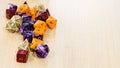 Colorful roleplaying dice scattered on a table Royalty Free Stock Photo