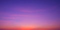 Colorful romantic twilight sky with beautiful pink sunset cloud and orange sunlight on dark blue sky after sundown in evening time Royalty Free Stock Photo