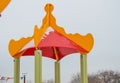 Colorful roof of the Playground in the form of a house or gazebo in the amusement Park, winter, snow Royalty Free Stock Photo