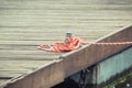 Colorful rope on bridge as part of yacht anchor. Detail of sailboat Royalty Free Stock Photo