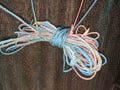 colorful ropes intertwine against a black background