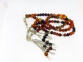Colorful rosary varieties, white background.