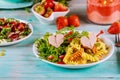 Colorful rotini, hearts from hot dogs and veggies salad. Valentines Day concept