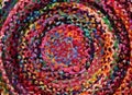 Colorful round african peruvian style rug or woven carpet surface close up. Ethnic and tribal motives. Bright accent in