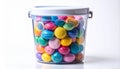 Colorful Round Candies Inside Clear Plastic Container on White Background Royalty Free Stock Photo
