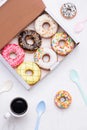 Colorful round donuts in the box