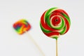 Colorful round lollipop, bright sweet candy in white, red and green colors. Christmas or New year lollipop on white background Royalty Free Stock Photo