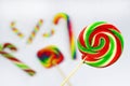 Colorful round lollipop, bright sweet candy in white, red and green colors. Christmas or New year lollipop on white background Royalty Free Stock Photo