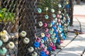 Colorful and round soft decorations on the net fence