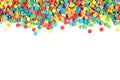 Colorful round sprinkles or sugar confetti on white background,