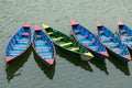 Colorful row boats docked on Lake Phewa in Pokhara Royalty Free Stock Photo