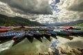 Colorful row boats docked on Lake Phewa