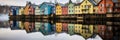 Colorful row of homes on a lake. Reflection of houses in the water. Old buildings in Europe. Architectural landscape.