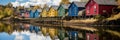 Colorful row of homes on a lake. Reflection of houses in the water. Old buildings in Europe. Architectural landscape.