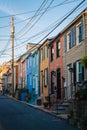 Colorful row houses along Chapel Street in Butchers Hill, Baltimore, Maryland