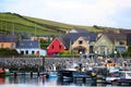 A colorful bayside village in front of boats in Dingle, Ireland. Royalty Free Stock Photo