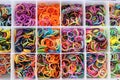 Colorful rubber bands in a box texture background