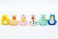 Colorful rubber ducks in a row isolated on a white background Royalty Free Stock Photo