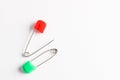 Colorful safety pins on white background, flat lay. Space for text Royalty Free Stock Photo