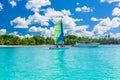 Colorful sail catamaran on the beach of Bayahibe at Caribbean Sea