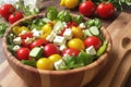 colorful salad, crumbled feta, mixed greens, plump cherry tomatoes, crisp cucumber