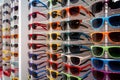 Colorful sales rack displays sunglasses for vibrant summer style Royalty Free Stock Photo