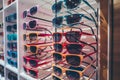 Colorful sales rack displays sunglasses for vibrant summer style Royalty Free Stock Photo