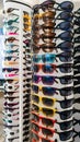 Colorful sales rack displays sunglasses for vibrant summer style Royalty Free Stock Photo