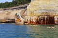 Colorful sandstone cliffs and formations welcoming kayakers at Pictured Rocks National Lakeshore of Lake Superior, Munising, Michi Royalty Free Stock Photo