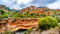 The colorful sandstone mountains and canyon carved by Oak Creek at famous Slide Rock State Park along Arizona SR89A Royalty Free Stock Photo