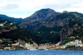 Scene in Amalfi coast with momentous montains and a populated area below full of buildings