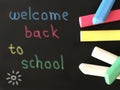 Colorful school chalks on blackboard background with simple colorful text. Royalty Free Stock Photo