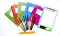 Colorful school exercise books and drawing pencils on white background Royalty Free Stock Photo