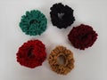 Colorful scrunchies on a plain white background