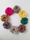 Colorful scrunchies on a plain white background