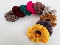 Colorful scrunchies on a plain white background