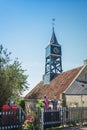 Colorful sculptures in the garden next to a small church in the