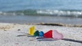 Colorful sea glass on beach sand with seascape background. Beachcombing