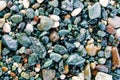 Colorful sea pebbles on the shore close up. Top view  flat lay. Abstract background texture  sea stones Royalty Free Stock Photo