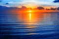 Colorful sea sunset view, bright ocean sunrise, yellow golden sun reflection, blue water waves, red orange sky, tropical island Royalty Free Stock Photo