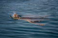 Colorful sea turtle caretta caretta swimming in the azure sea in Zakynthos Island, Greece.