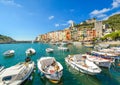 Colorful sea and village of Portovenere, Italy, with it`s harbor, pier, cafes and ancient fort and castle on the Ligurian Coast