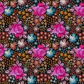 Colorful seamless ditsy pattern with embroidered flowers. Roses and wildflowers on black background. Bright summer design Royalty Free Stock Photo