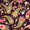 Colorful seamless ethnic ornament with paisley, leaves and flowers on dark purple background. Print for fabric, wallpaper Royalty Free Stock Photo