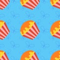 Colorful seamless pattern of appetizing cupcakes on a blue background. Simple flat vector illustration. For the design of paper